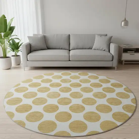 8' Gold And Ivory Polka Dot Washable Round Rug With UV Protection Photo 2