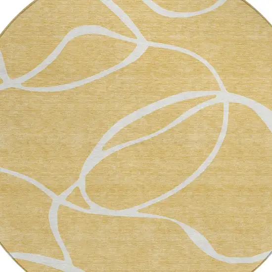 8' Gold And Ivory Round Abstract Washable Indoor Outdoor Area Rug Photo 4