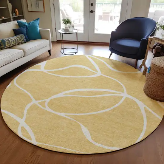8' Gold And Ivory Round Abstract Washable Indoor Outdoor Area Rug Photo 8
