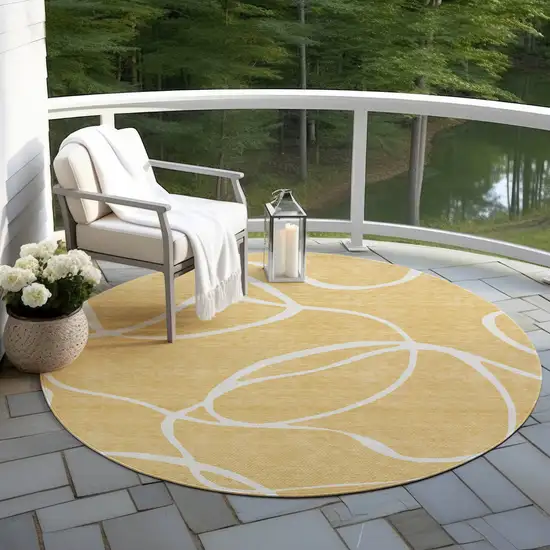8' Gold And Ivory Round Abstract Washable Indoor Outdoor Area Rug Photo 7