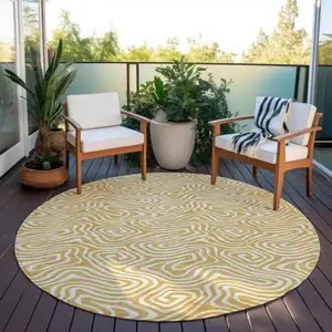 Photo of 8' Gold And Ivory Round Abstract Washable Indoor Outdoor Area Rug