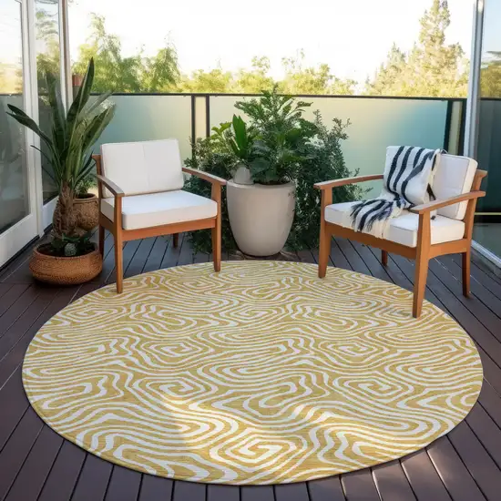 8' Gold And Ivory Round Abstract Washable Indoor Outdoor Area Rug Photo 7