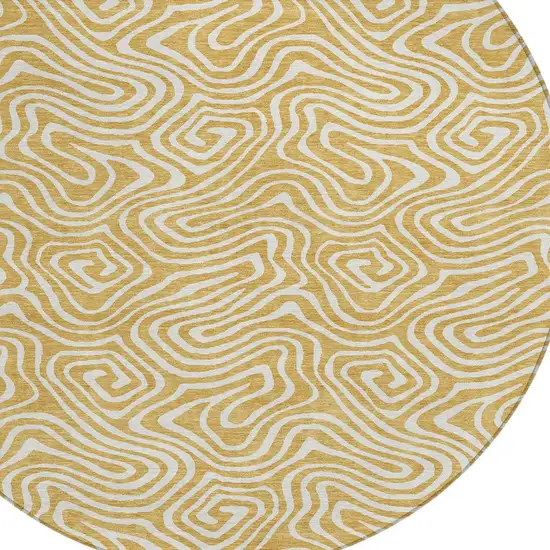 8' Gold And Ivory Round Abstract Washable Indoor Outdoor Area Rug Photo 5