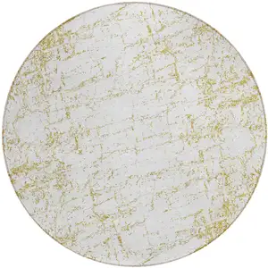 Photo of 8' Gold And Ivory Round Abstract Washable Indoor Outdoor Area Rug