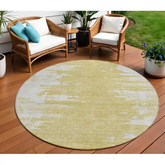 8' Gold And Ivory Round Abstract Washable Indoor Outdoor Area Rug Photo 1