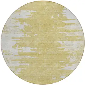 Photo of 8' Gold And Ivory Round Abstract Washable Indoor Outdoor Area Rug