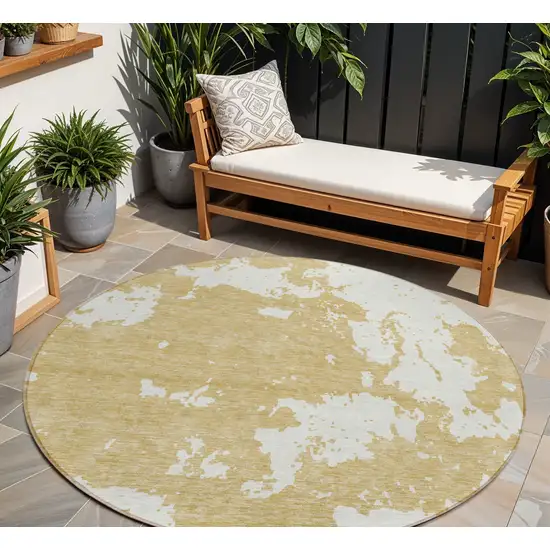 8' Gold And Ivory Round Abstract Washable Indoor Outdoor Area Rug Photo 1