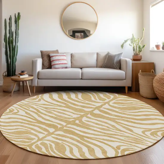 8' Gold And Ivory Round Animal Print Washable Indoor Outdoor Area Rug Photo 8