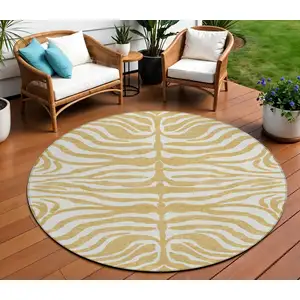 Photo of 8' Gold And Ivory Round Animal Print Washable Indoor Outdoor Area Rug