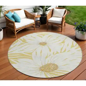 Photo of 8' Gold And Ivory Round Floral Washable Indoor Outdoor Area Rug