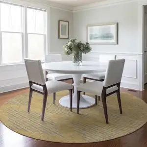 Photo of 8' Gold And Ivory Round Geometric Washable Indoor Outdoor Area Rug