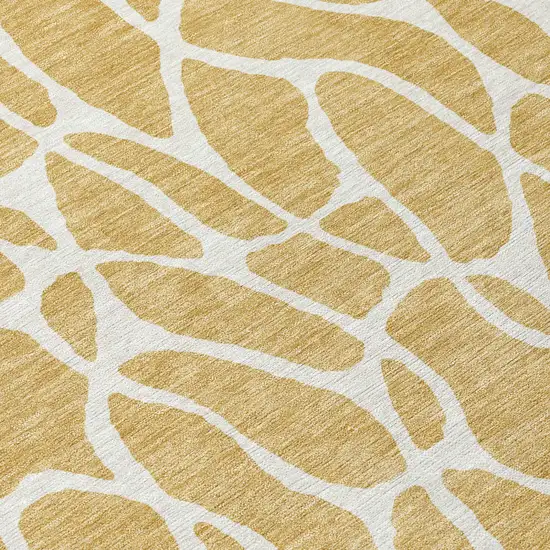 8' Gold And Ivory Round Geometric Washable Indoor Outdoor Area Rug Photo 8