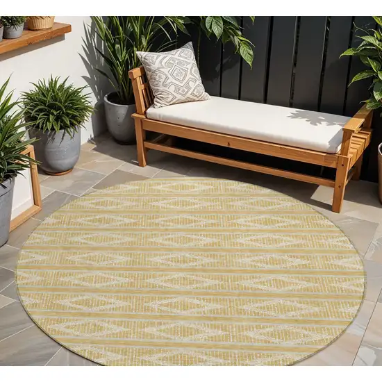 8' Gold And Ivory Round Geometric Washable Indoor Outdoor Area Rug Photo 1