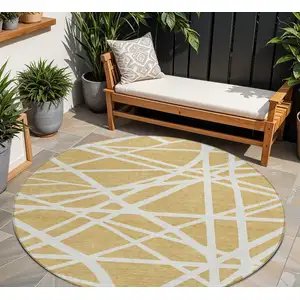 Photo of 8' Gold And Ivory Round Geometric Washable Indoor Outdoor Area Rug