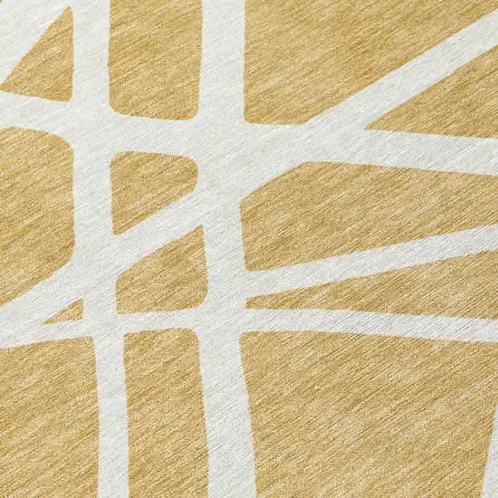 8' Gold And Ivory Round Geometric Washable Indoor Outdoor Area Rug Photo 8