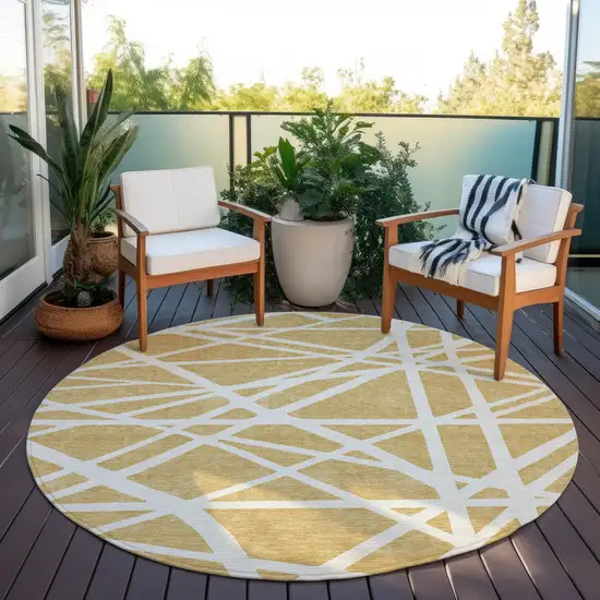 8' Gold And Ivory Round Geometric Washable Indoor Outdoor Area Rug Photo 6