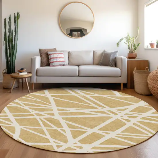 8' Gold And Ivory Round Geometric Washable Indoor Outdoor Area Rug Photo 7