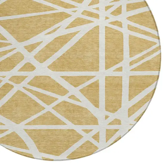 8' Gold And Ivory Round Geometric Washable Indoor Outdoor Area Rug Photo 4