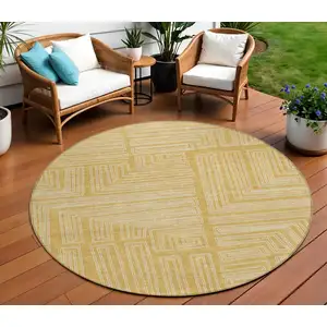 Photo of 8' Gold And Ivory Round Geometric Washable Indoor Outdoor Area Rug