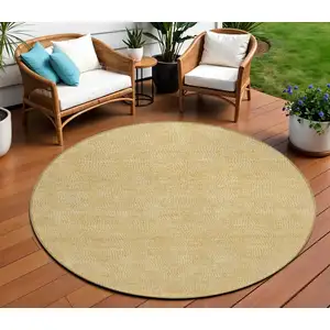 Photo of 8' Gold And Ivory Round Geometric Washable Indoor Outdoor Area Rug