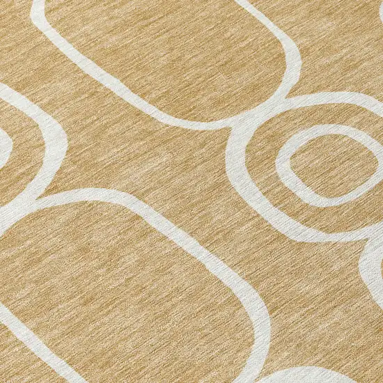 8' Gold And Ivory Round Geometric Washable Indoor Outdoor Area Rug Photo 9