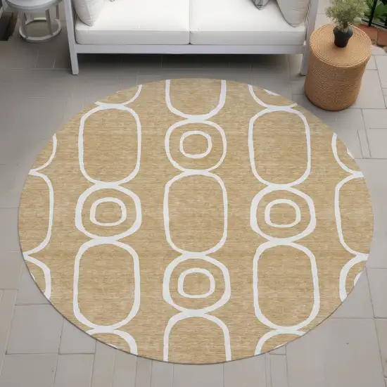 8' Gold And Ivory Round Geometric Washable Indoor Outdoor Area Rug Photo 7