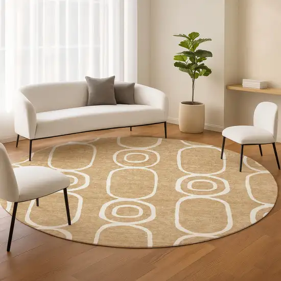 8' Gold And Ivory Round Geometric Washable Indoor Outdoor Area Rug Photo 8