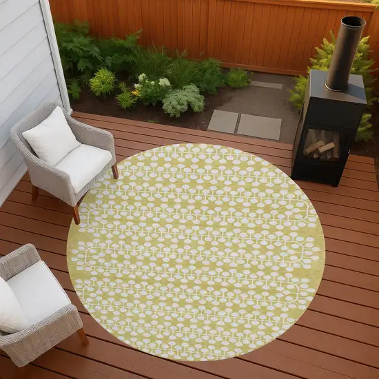 8' Gold And Ivory Round Geometric Washable Indoor Outdoor Area Rug Photo 7