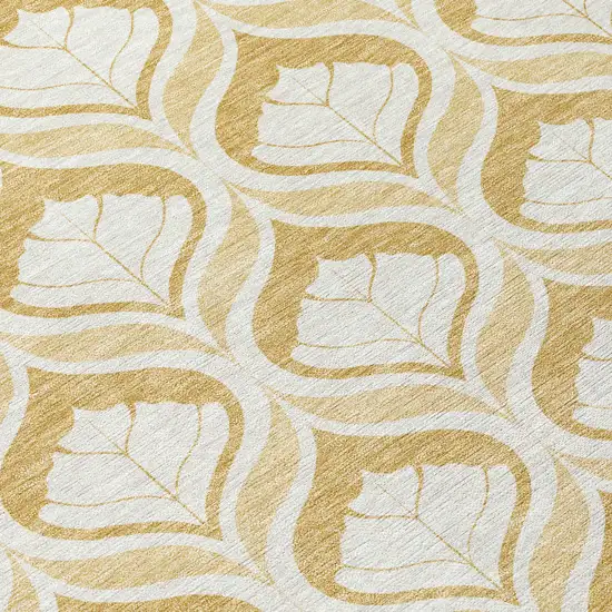 8' Gold And Ivory Round Geometric Washable Indoor Outdoor Area Rug Photo 9