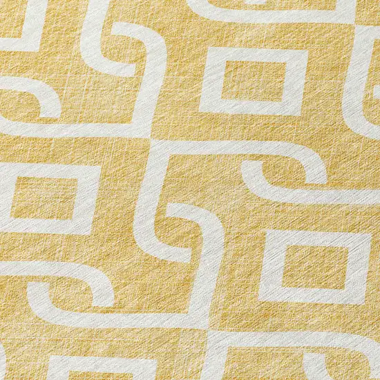 8' Gold And Ivory Round Geometric Washable Indoor Outdoor Area Rug Photo 7
