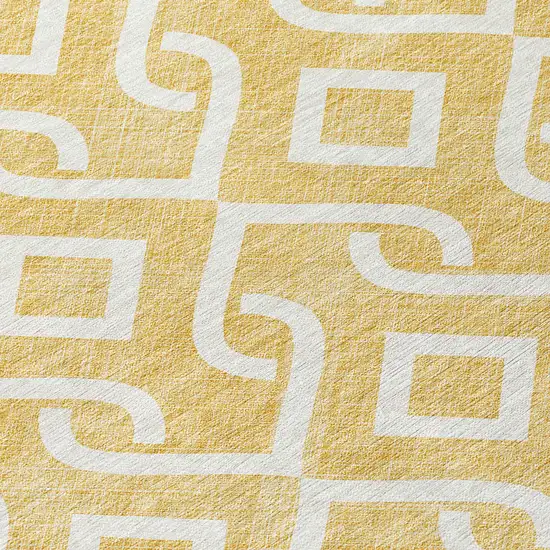 8' Gold And Ivory Round Geometric Washable Indoor Outdoor Area Rug Photo 7