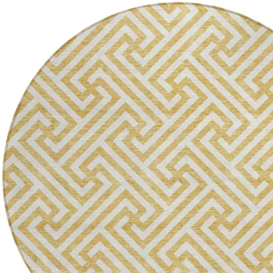8' Gold And Ivory Round Geometric Washable Indoor Outdoor Area Rug Photo 4