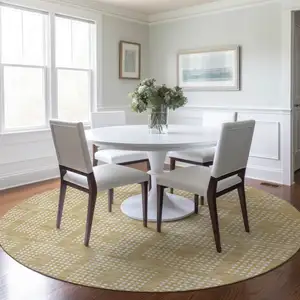 Photo of 8' Gold And Ivory Round Geometric Washable Indoor Outdoor Area Rug