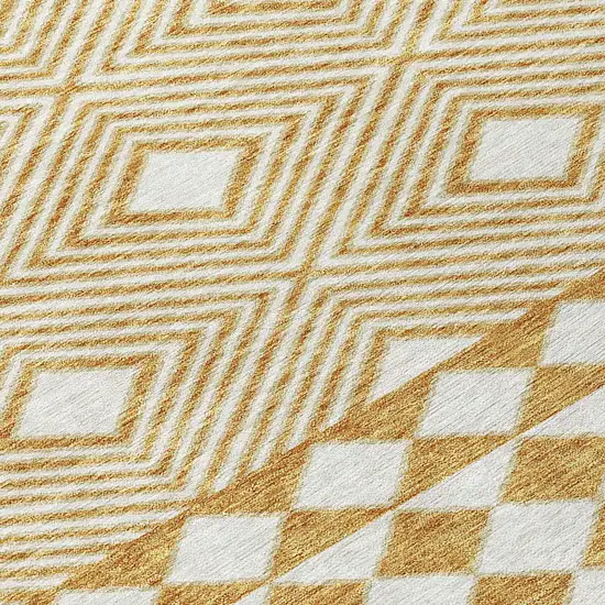 8' Gold And Ivory Round Geometric Washable Indoor Outdoor Area Rug Photo 5