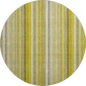 Photo of 8' Gold And Ivory Striped Washable Round Rug With UV Protection