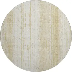 Photo of 8' Gold And Ivory Striped Washable Round Rug With UV Protection