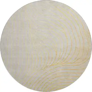 Photo of 8' Gold And Silver Abstract Washable Round Rug With UV Protection