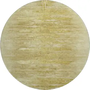 Photo of 8' Gold And Wheat Abstract Washable Round Rug With UV Protection
