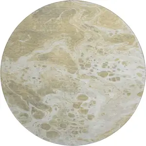 Photo of 8' Gold Beige And Ivory Abstract Washable Round Rug With UV Protection