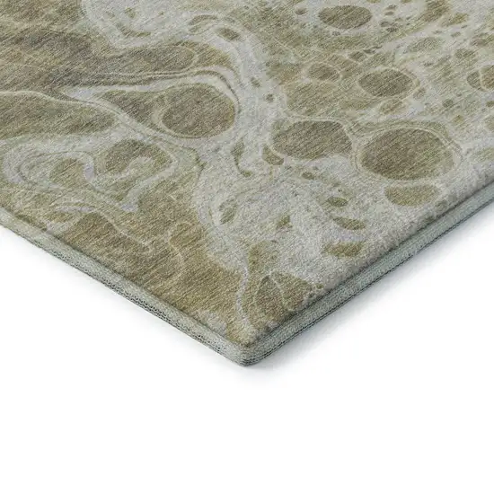 8' Gold Beige And Ivory Abstract Washable Round Rug With UV Protection Photo 6