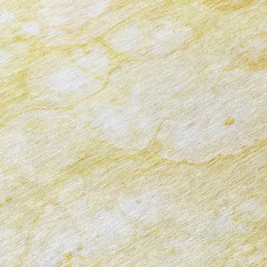 8' Gold Beige And Ivory Round Abstract Washable Indoor Outdoor Area Rug Photo 9