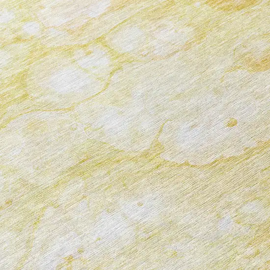 8' Gold Beige And Ivory Round Abstract Washable Indoor Outdoor Area Rug Photo 9