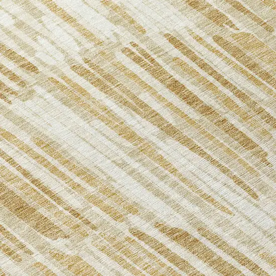 8' Gold Beige And Ivory Round Abstract Washable Indoor Outdoor Area Rug Photo 8