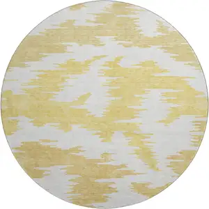 Photo of 8' Gold Beige And Wheat Abstract Washable Round Rug With UV Protection