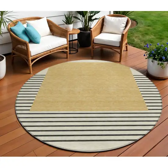 8' Gold Black And Beige Round Striped Washable Indoor Outdoor Area Rug Photo 1