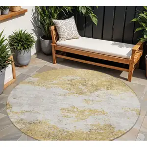 Photo of 8' Gold Brown And Beige Round Abstract Washable Indoor Outdoor Area Rug