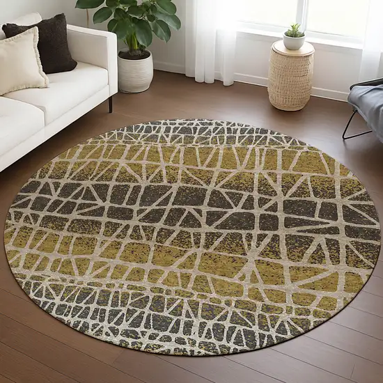 8' Gold Brown And Beige Round Geometric Washable Indoor Outdoor Area Rug Photo 5