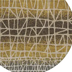Photo of 8' Gold Brown And Beige Round Geometric Washable Indoor Outdoor Area Rug