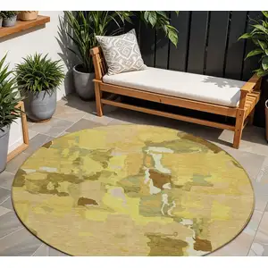 Photo of 8' Gold Brown And Green Round Abstract Washable Indoor Outdoor Area Rug