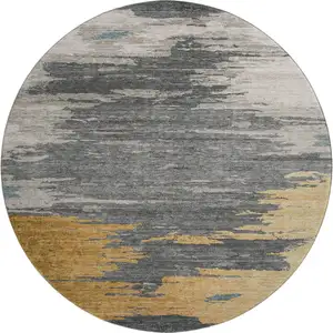 Photo of 8' Gold Charcoal And Gray Abstract Washable Round Rug With UV Protection